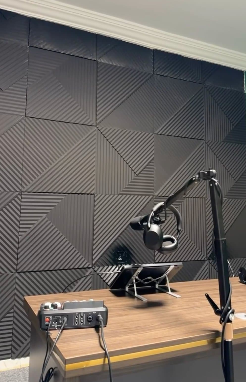 Recording desk with headphones and audio interface