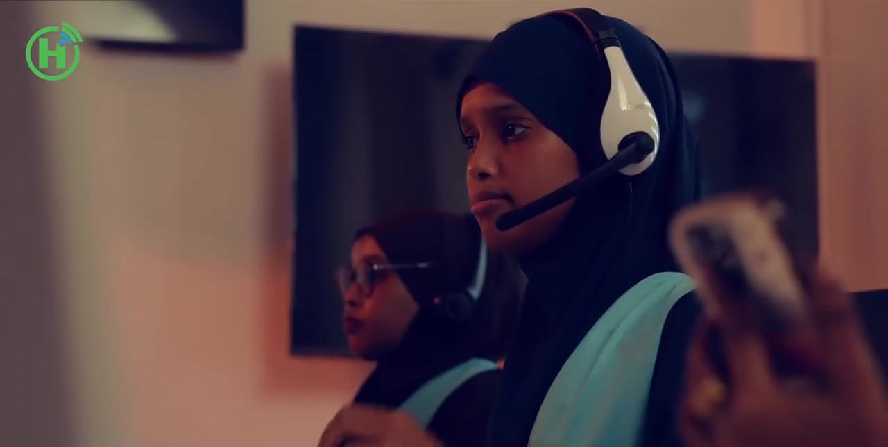 A Hormuud call-center agent wearing a headset