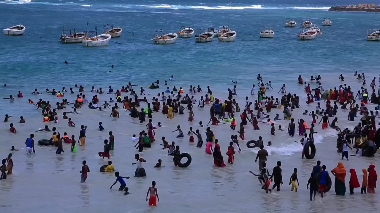 Crowds swimming at the beach in Mogadishu